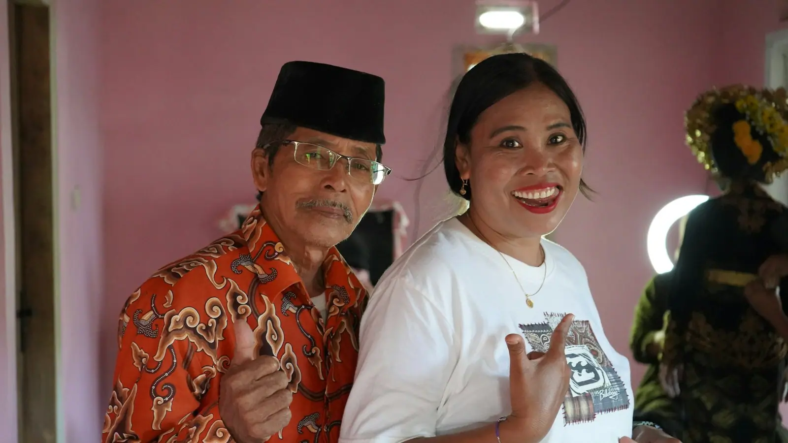 An older couple sitting together and smiling