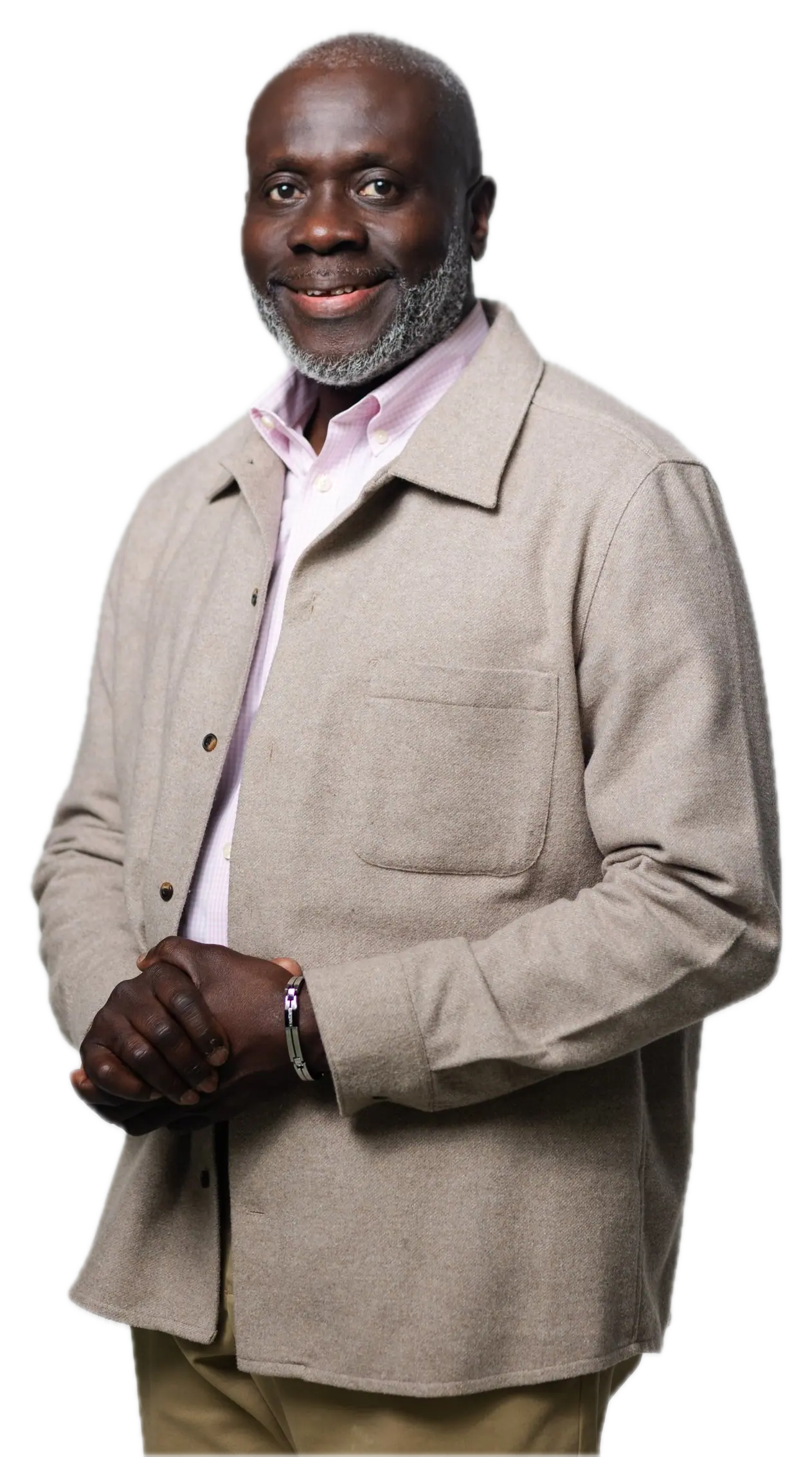 Pastor Victor K.A. Darteh, smiling, in a light jacket with his hands folded